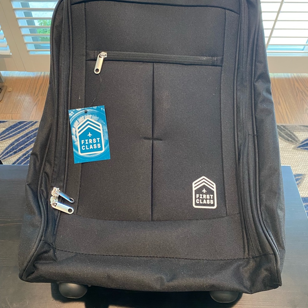 (2) First Class 22" Upright Rolling Carry-On